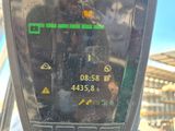 a close up of a parking meter with a clock on it