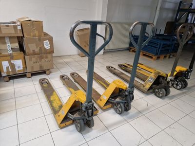 two pallets that are sitting on the floor in a warehouse
