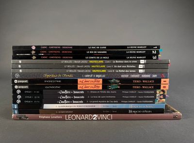 many books stacked on top of each other on a table