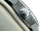 a close up of a watch on the wrist of a person