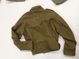 an image of a jacket and pants laid out on a white surface
