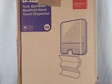 packaging for a tork paper towel dispenser in a cardboard box