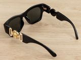 a close up of a pair of sunglasses on a wooden surface