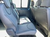 a seat in the back of a van with a seat belt