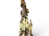 statue of a bird on a rock with other birds around it