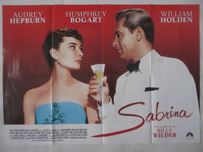 deux affiches de cinéma représentant un homme et une femme tenant des verres à vin