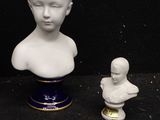 a white bust of a child next to a small bust of a woman