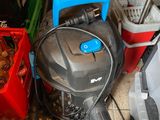 a vacuum that is sitting on the floor next to other items