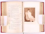 an open book with a picture of a woman sitting on a chair
