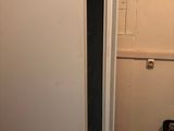 an image of a refrigerator in a kitchen with the door open