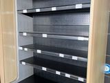 an empty display case in the middle of a store