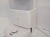 a robot that is sitting on the floor in a room
