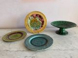 three plates and a bowl sitting on a table