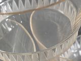 three clear bowls sitting on top of a table