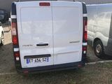 a white van that is parked in a parking lot