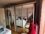 a room with a bed and a chair in it