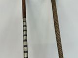 pair of silver and wood walking canes with silver and wood handles