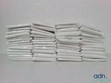 a pile of white toilet paper sitting on a table