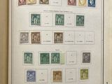 an open book with a bunch of stamps on it