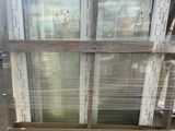 a wooden pallet that has some old windows on it