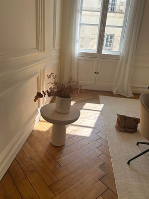 a room with a chair and a table in it
