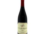 a bottle of wine that is sitting on a table