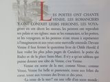 an open book with a picture of a building in the background