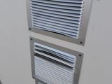 a air conditioner that is on the side of a building