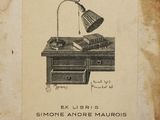 an old picture of a desk with a lamp on top of it