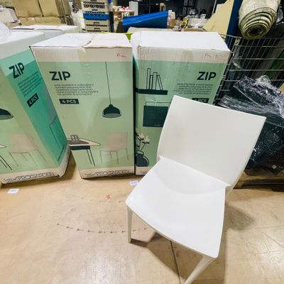 three boxes and a chair sitting on the floor
