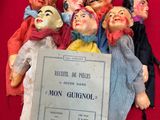 a bunch of dolls that are sitting on a table