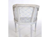 an image of a white chair with a cane back