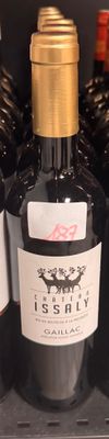 several bottles of wine are sitting on a shelf in a store