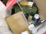 a box full of assorted items sitting on the floor