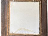 an old picture frame with a white background and a brown wood frame