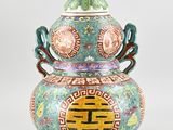 an image of a decorative vase with a lid and handles on a white background