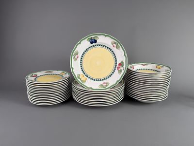 a set of twelve plates with floral designs on them