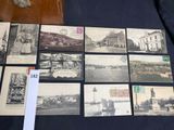 a lot of old postcards that are on a table