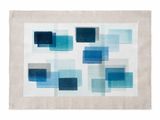 a white and blue rug with squares on it
