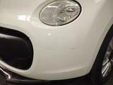 a close up of a white car with a light on