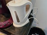 a coffee maker and a tea kettle on a counter