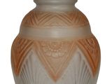 a vase that is sitting on a white surface