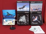 de nombreux modèles réduits d'avions posés sur une table rouge