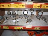 many different gauges on the shelf in the store