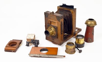 many different types of antique cameras on the table