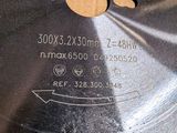 a close up of a circular saw blade on a table