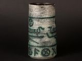 a close up of a vase on a black surface