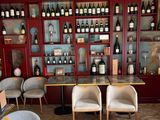 many bottles of wine on the shelves in this room