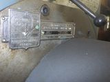 a close up of a metal plate on a machine