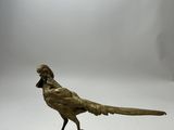 a bronze statue of a pheasant on a marble base